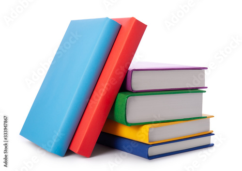 Stack of colorful books isolated on white background. Collection of different books. Hardback books for reading. Back to school and education learning concept
