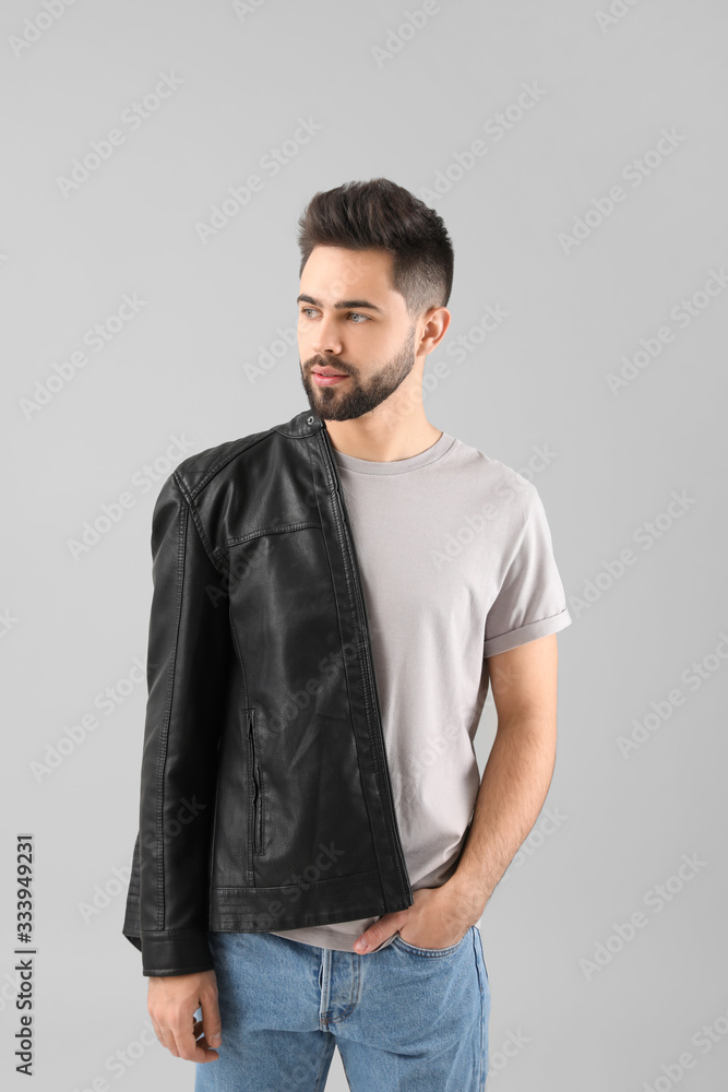 Handsome man with healthy hair on light background Handsome man with healthy hair on light background