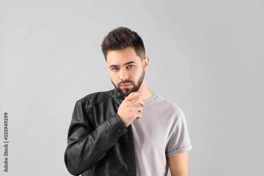 Handsome man with healthy hair on light background Handsome man with healthy hair on light background