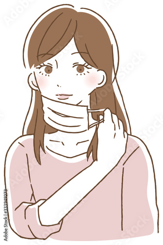 マスクの紐を持って外す女性
