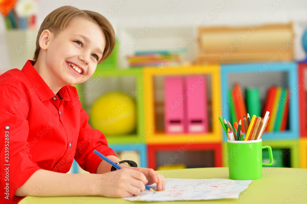 Portrait of cute little boy drawing with pencils Portrait of cute little boy drawing with pencils