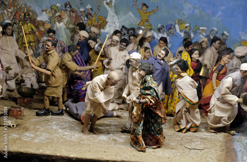 Schilderij op canvas Scenes from the life of Mahatma Gandhi: Mahatma Gandhi break the nefarious salt