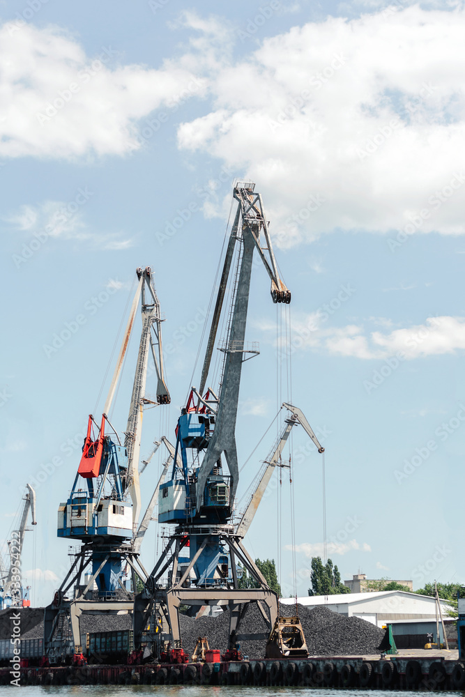Ships in Sea port with cranes,
