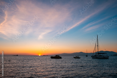 Sunset in Mykonos island, Greece with yachts in the harbor romantic spot on sunset. Mykonos town, Greece © Dmitry Rukhlenko