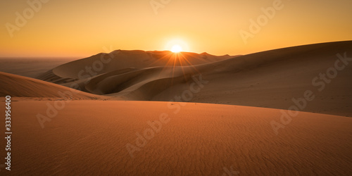 sunset in the desert dunes in Namibia without people
