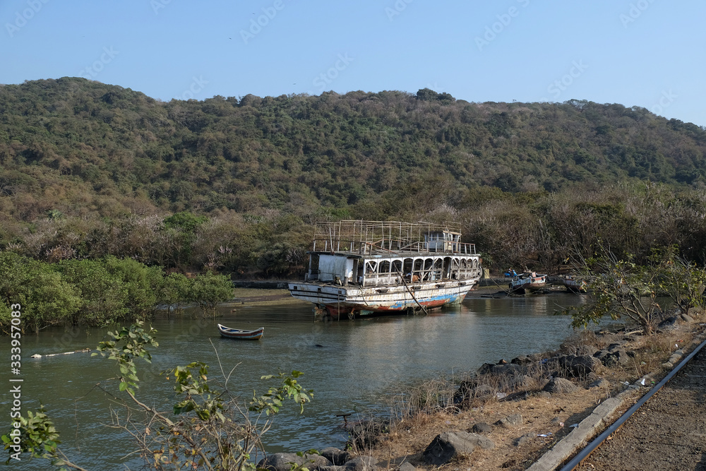 Fototapeta premium Abandoned tourist boat on Elefanta Island near Mumbai, India