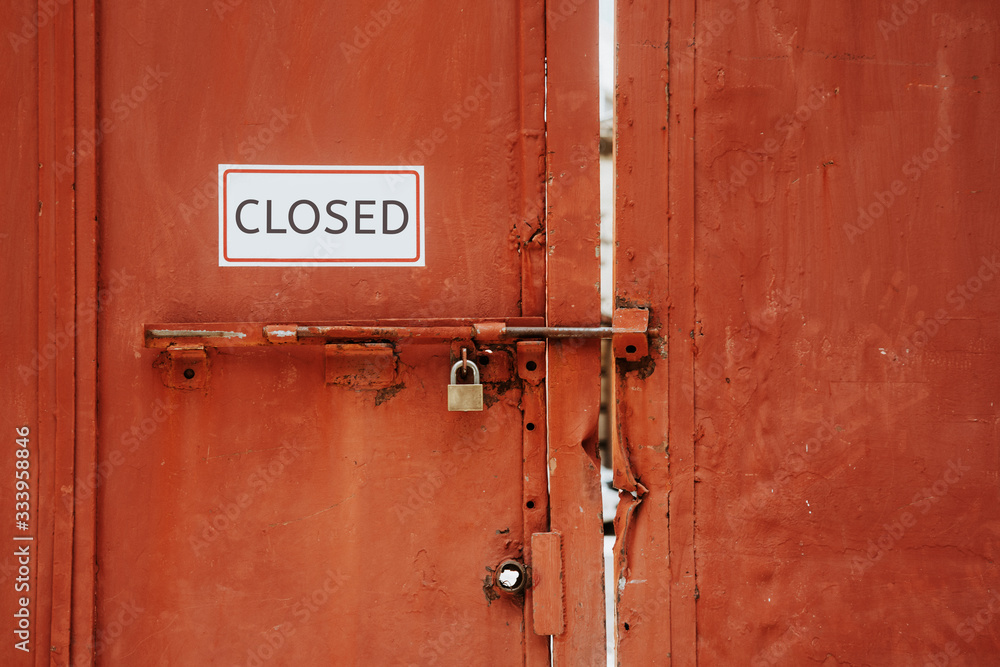 Closed sign hanging outside a restaurant, store, office or other Closed sign hanging outside a restaurant, store, office or other