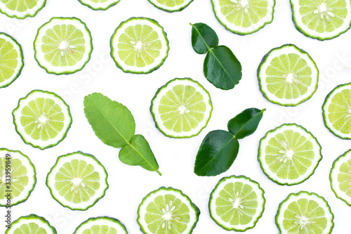 Fresh bergamot slices with green leaf isolated on white background. Top view. Flat lay.