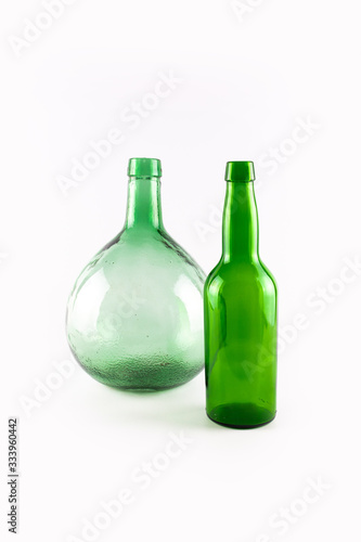 Vintage empty demijohn and green bottle