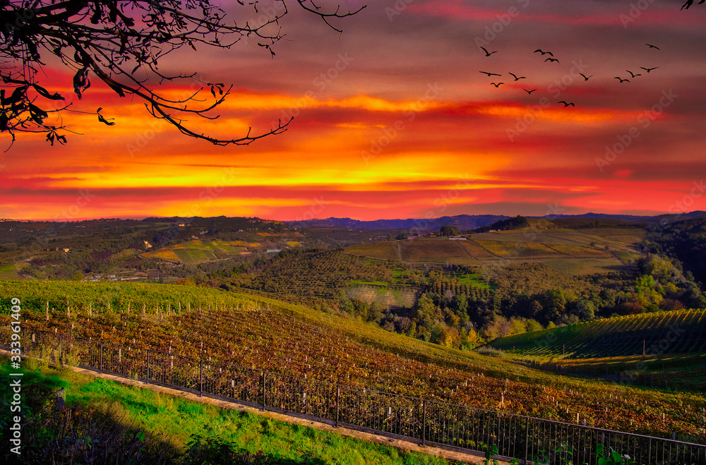sunset with a fiery sky over the Langhe around Alba
