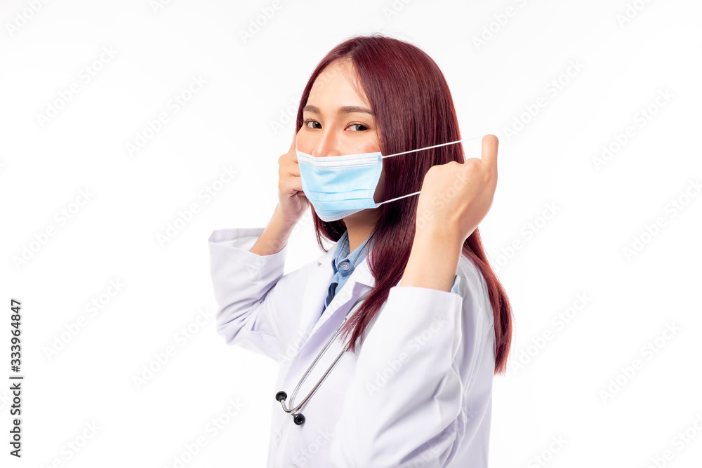 Young female asian doctor wear face mask, protecting infected of viruses, coronavirus, diseases. Beautiful doctor wear coat, stethoscope around neck. She get happy with smile face. white background Young female asian doctor wear face mask, protecting infected of viruses, coronavirus, diseases. Beautiful doctor wear coat, stethoscope around neck. She get happy with smile face. white background