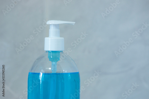 Liquid hygienic soap of blue color. Coronavirus prophylaxis, hand sanitizer. Hygiene concept.