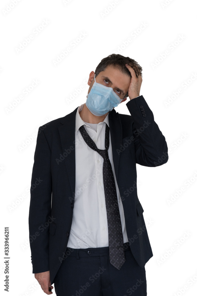 Dejected and sick businessman wears a protective mask to protect himself from disease. Dejected and sick businessman wears a protective mask to protect himself from disease.