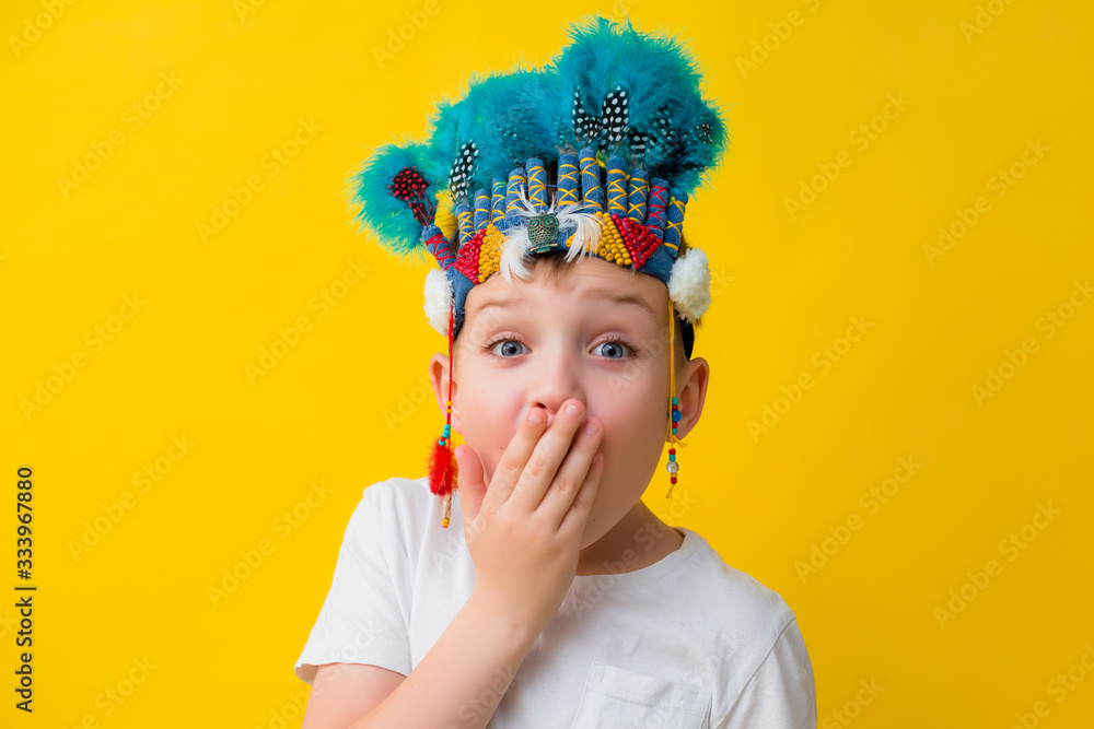 © КРИСТИНА Игумнова - little boy in an Indian costume on a yellow background © КРИСТИНА Игумнова - little boy in an Indian costume on a yellow background