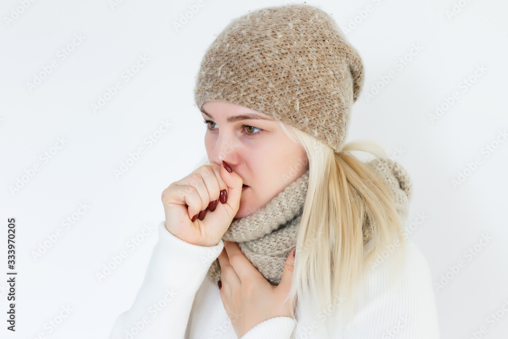Fotka „Young ill female have a cough and sore throat in winter. Causes