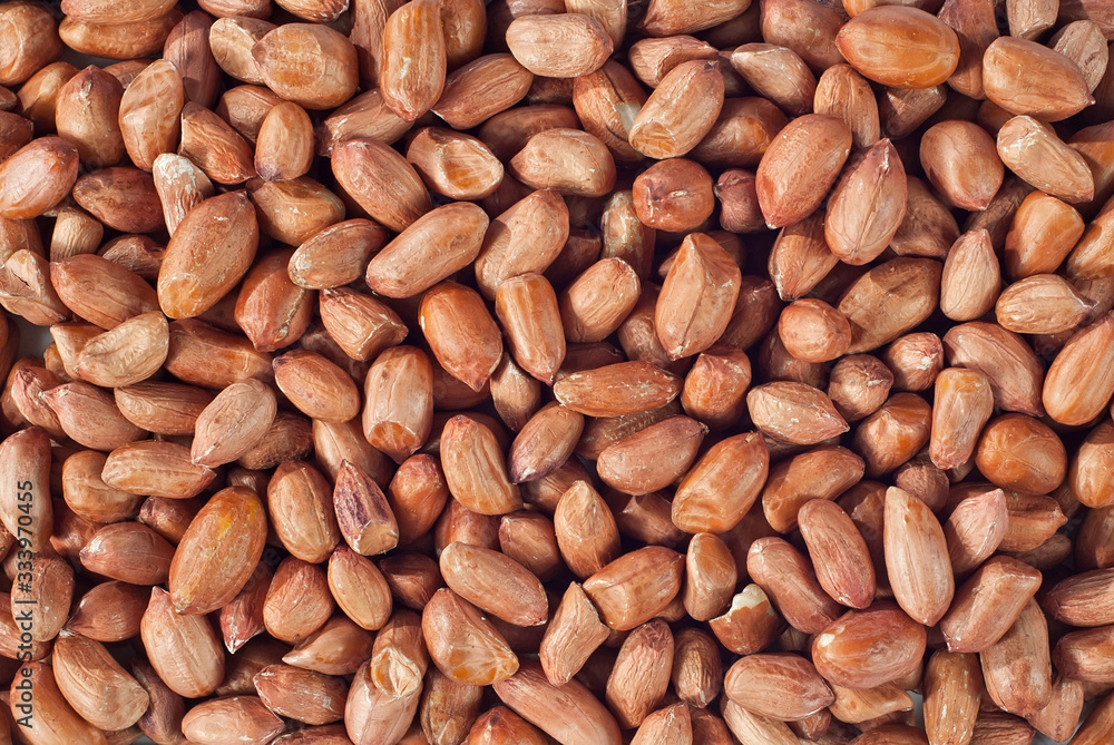 Dry peanut texture. Many peanut grains on the pile. Dry peanut texture. Many peanut grains on the pile.