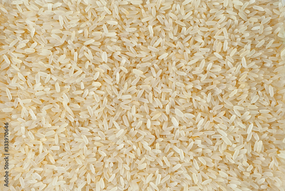 Texture of white polished rice. Lots of rice on the pile. Texture of white polished rice. Lots of rice on the pile.