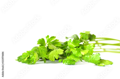 Green bunch of parsley isolated on white background, studio photo