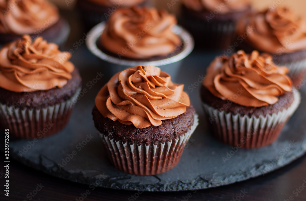 Chocolate cupcakes with chocolate cream on top