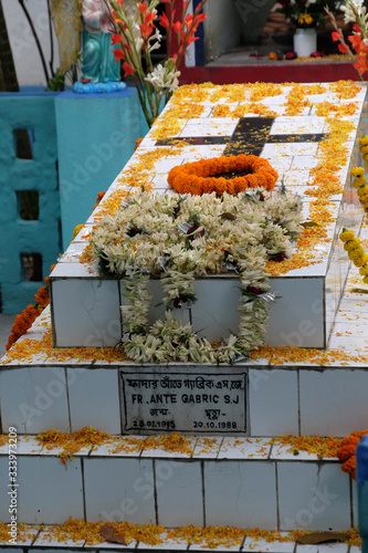 The tomb of a Croatian missionary, Jesuit father Ante Gabric, decorated on the occasion of his 105th birthday in Kumrokhali, West Bengal, India photo