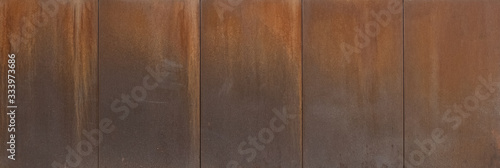 The surface is painted rust. Rusted metal wall. Metal rust background .Grunge rusty metal texture