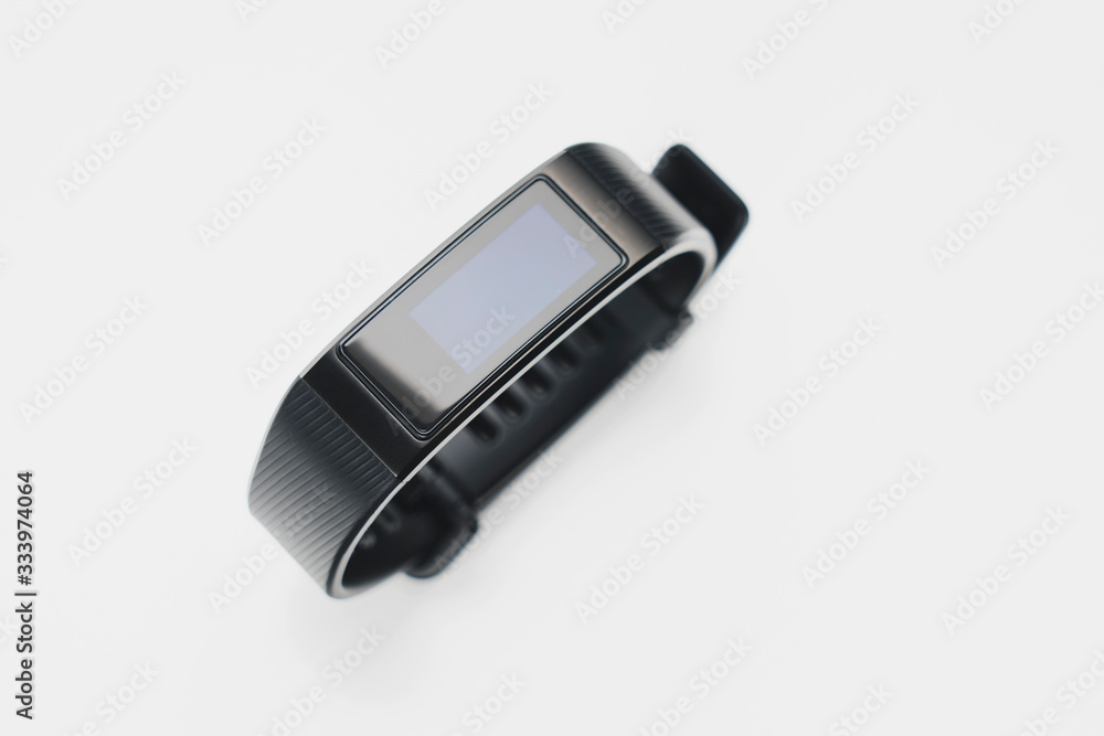 fitness tracker on a white background, selective focus, tinted image. fitness tracker on a white background, selective focus, tinted image.