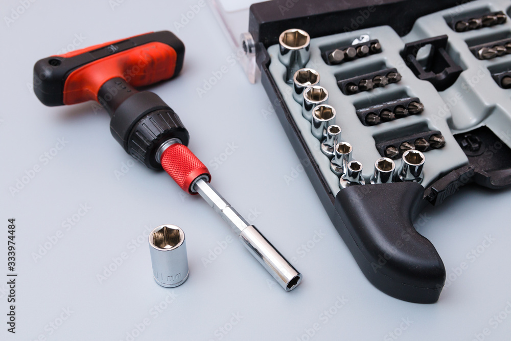 adjustable spanners set with red holder over a grey background. father's day gift