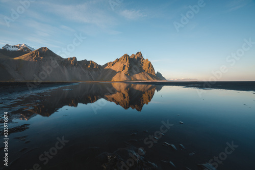 Sunset along the coastline of South Iceland with Beautiful Mountains and Reflection of Landscape