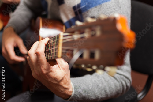 Detail of a classical guitar player