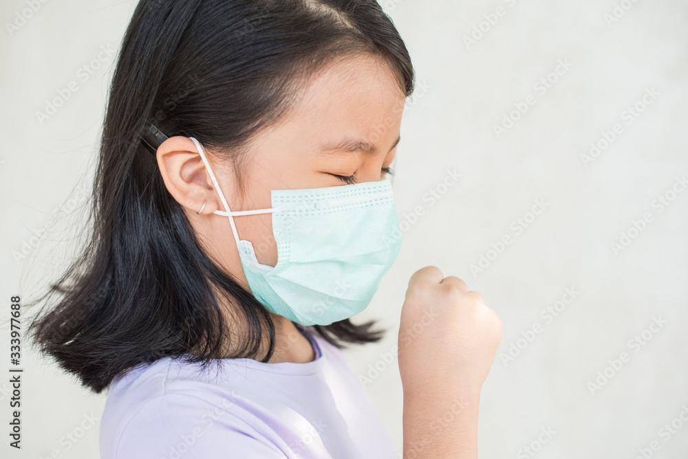 asia women wearing hygienic mask to prevent the virus PM2.5, Coronavirus, (2019-nCoV) asian little girl feeling unwell and coughing as symptom for cold or pneumonia,bronchitis. healthcare concept. asia women wearing hygienic mask to prevent the virus PM2.5, Coronavirus, (2019-nCoV) asian little girl feeling unwell and coughing as symptom for cold or pneumonia,bronchitis. healthcare concept.