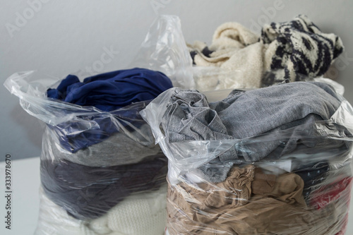 Everyday clothes packed in plastic bags
