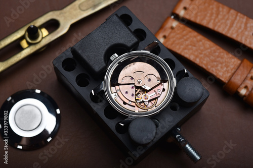 Watch repair, Vintage wrist watch overhaul and service checking mechanical movement by watchmaker.