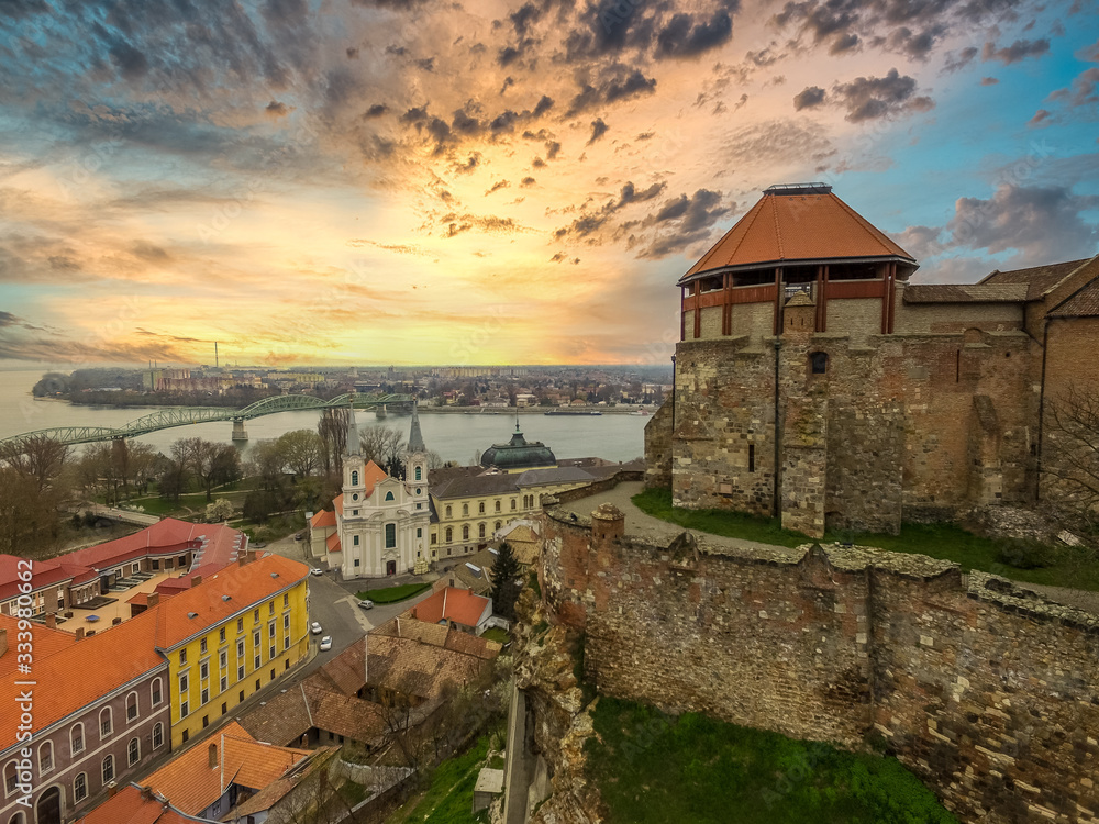 beautiful sunset over Esztergom city center and castle in Hungary with the Danube and Sturovo Slovakia in the background