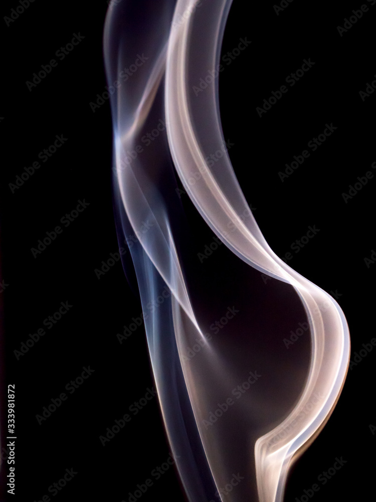 Cigarette smoke on black background, macro shot Cigarette smoke on black background, macro shot