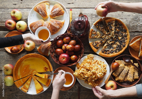 Meeting friends at the festive table to celebrate the Passover.The view from the top,the guest hands over the food table.