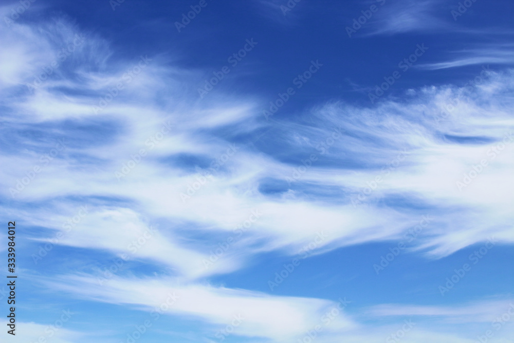 Beautiful blue sky and white cirrus clouds. Horizontal view. Background. Landscape.