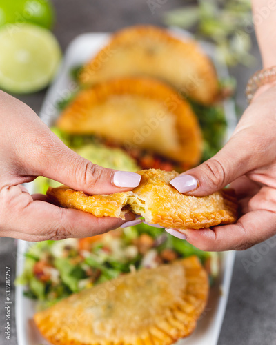 Breaking open an empanada
