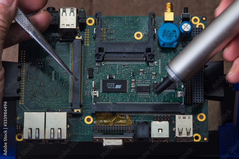 Fototapeta premium Fix and repair of electronic computer board