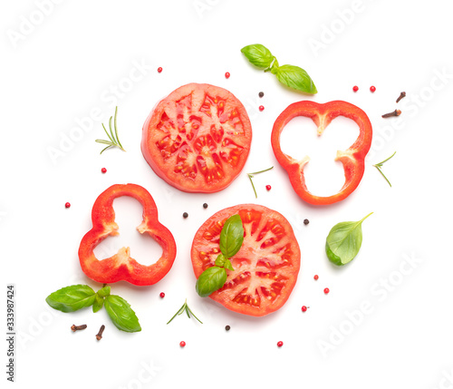Sliced tomatoes and basil top view and flat lay