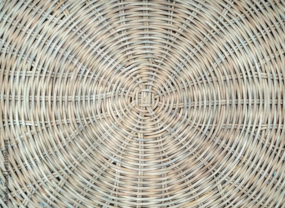 The woven texture of rattan in light brown color. Can be used as a background