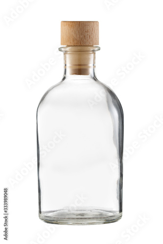 Transparent bottle with wooden cork isolated on a white background.