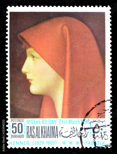 Cancelled postage stamp printed by Ras Al Khaima, that shows painting by Henner, circa 1988. photo