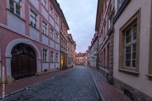 A street (Judenstrasse) at sunrise in Bamberg, Germany, A Unesco World Heritage Site © maartenhoek