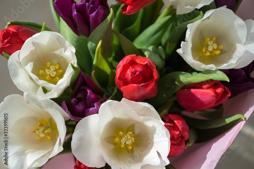 Spring floral arrangement. Bouquet of white  red and purple tulips