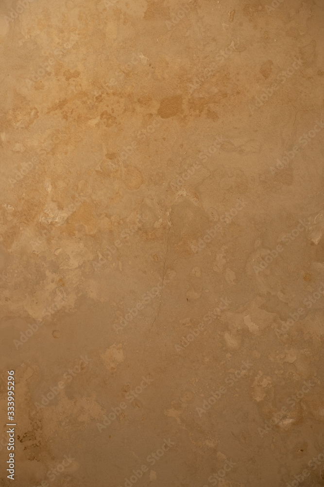 Ancient beige marble wall, background.