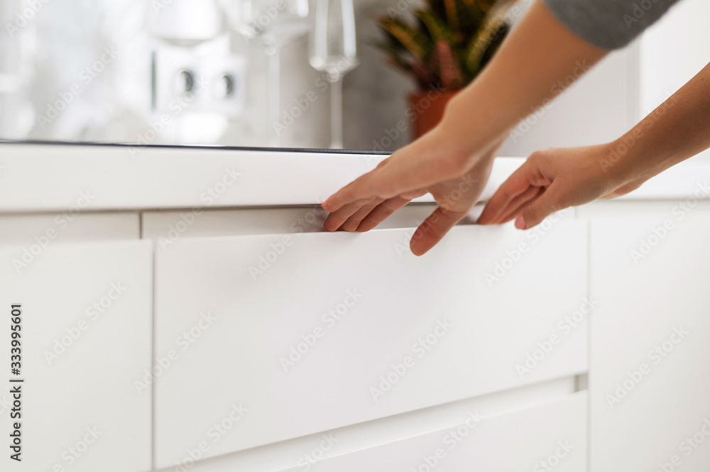 Demonstration of the kitchen. Kitchen cabinets, countertops, cooking areas. Closeup Demonstration of the kitchen. Kitchen cabinets, countertops, cooking areas. Closeup