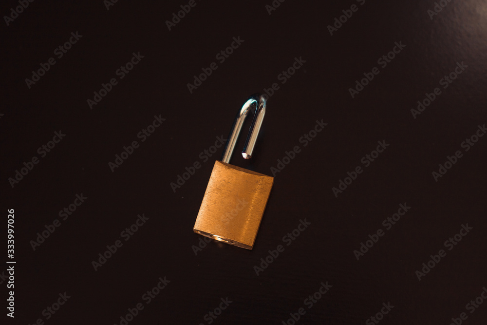 Padlock with key isolated on black background Padlock with key isolated on black background