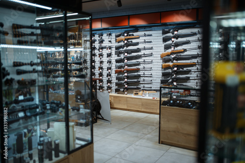 Rifle choice, showcase in gun shop, nobody