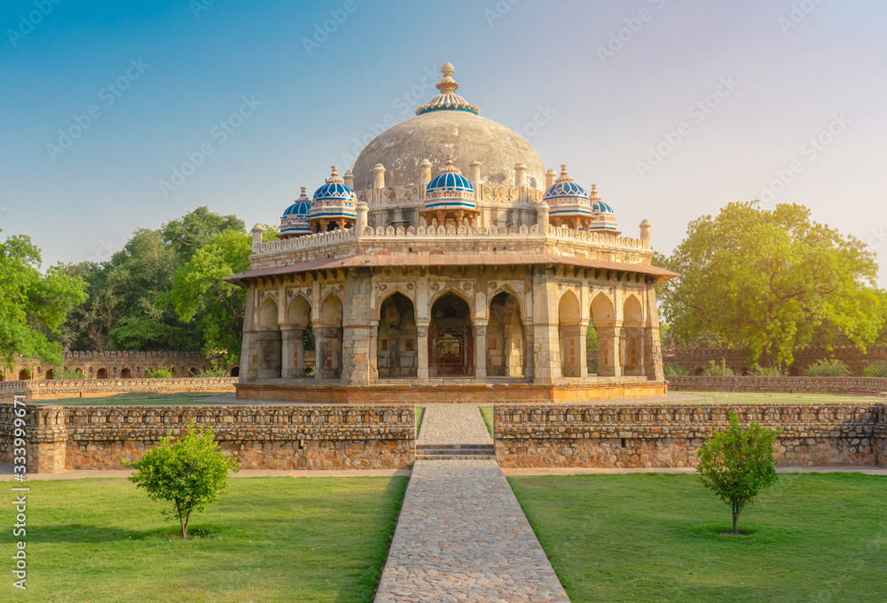 Dramatic view of Isa Khan Niyazi's tomb this octagonal tomb known for its sunken garden was built for a noble in the Humayun's Tomb complex with ray sunset. Historical Landmark of Delhi, India