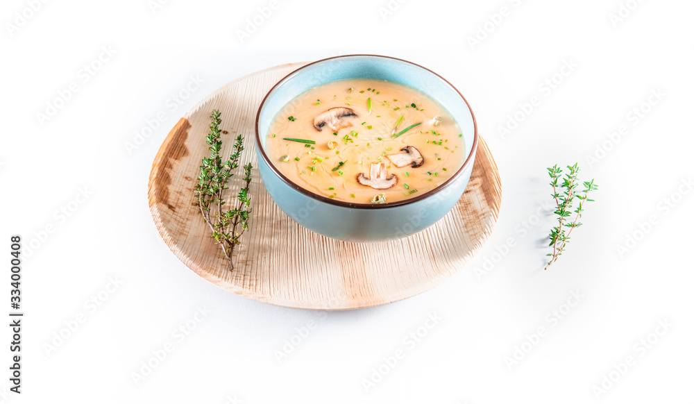 Delicious mushroom cream soup with champignons isolated on white background Delicious mushroom cream soup with champignons isolated on white background